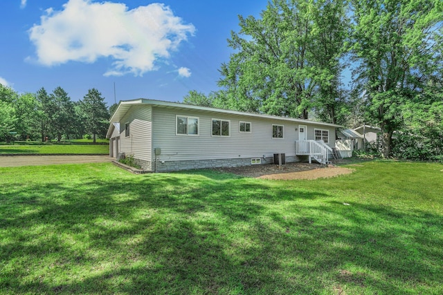 9353 Ideal Rd, Watab Twp, MN 56367 - rear view of house featuring a lawn and driveway