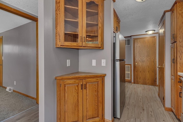 9353 Ideal Rd, Watab Twp, MN 56367 - hall featuring light wood-style flooring and a textured ceiling
