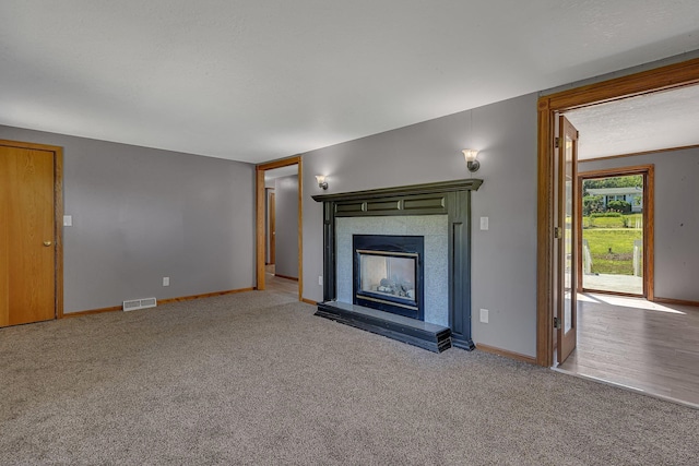 9353 Ideal Rd, Watab Twp, MN 56367 - unfurnished living room with carpet and a tiled fireplace