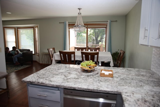 3930 99th Ave NE, Blaine, MN 55014 - kitchen featuring dishwasher, a chandelier, healthy amount of natural light, and dark wood-type flooring