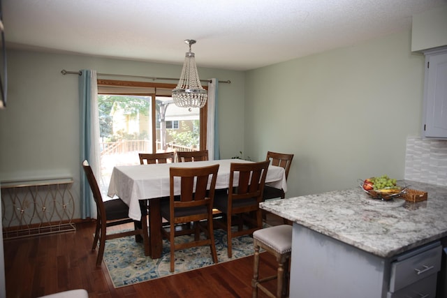 3930 99th Ave NE, Blaine, MN 55014 - dining room featuring a chandelier and dark wood finished floors