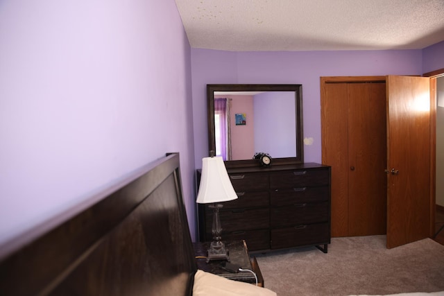 3930 99th Ave NE, Blaine, MN 55014 - bedroom featuring light colored carpet, a textured ceiling, and a closet