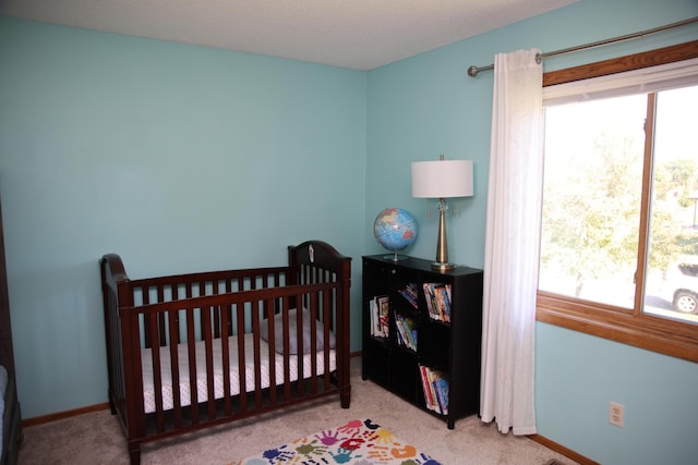 3930 99th Ave NE, Blaine, MN 55014 - carpeted bedroom featuring baseboards and a nursery area