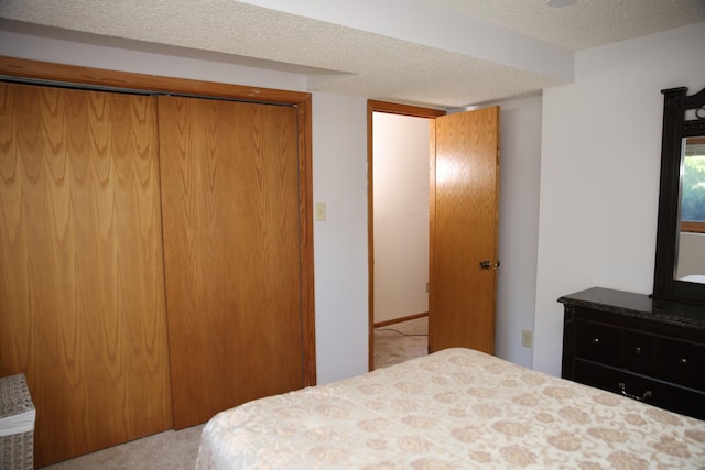 3930 99th Ave NE, Blaine, MN 55014 - bedroom featuring carpet floors, a closet, and a textured ceiling