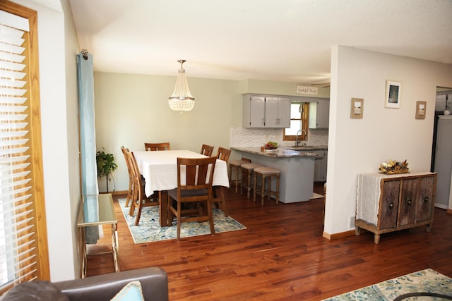 3930 99th Ave NE, Blaine, MN 55014 - dining room with dark wood finished floors and a chandelier