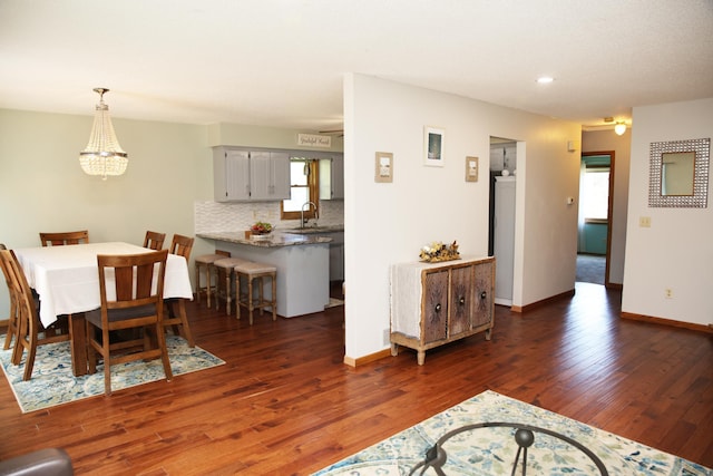 3930 99th Ave NE, Blaine, MN 55014 - dining space featuring wood finished floors, a chandelier, and recessed lighting
