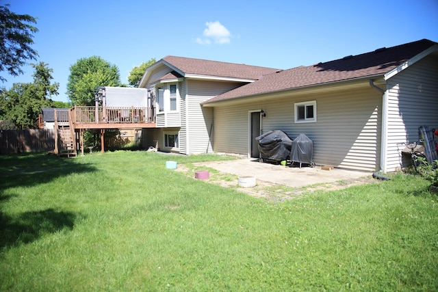 3930 99th Ave NE, Blaine, MN 55014 - rear view of house featuring a deck, a patio area, stairs, a yard, and roof with shingles