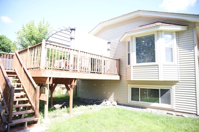 3930 99th Ave NE, Blaine, MN 55014 - back of property with stairs, a wooden deck, and a yard