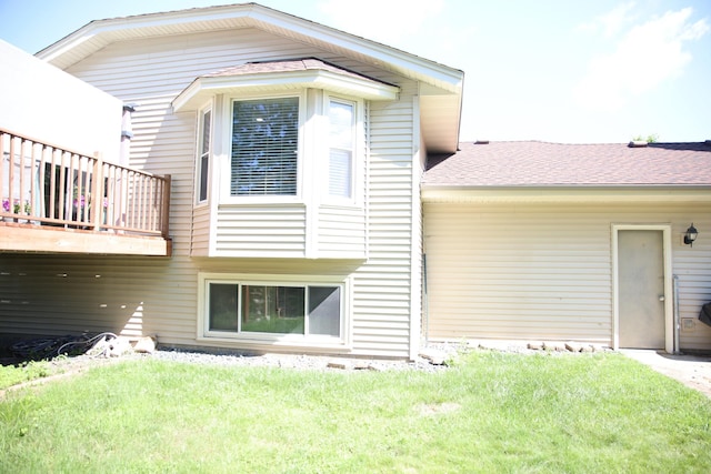 3930 99th Ave NE, Blaine, MN 55014 - rear view of house featuring a lawn and a shingled roof