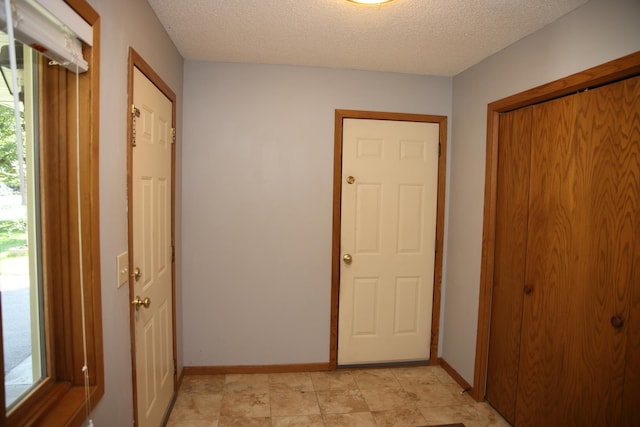 3930 99th Ave NE, Blaine, MN 55014 - hall featuring a textured ceiling