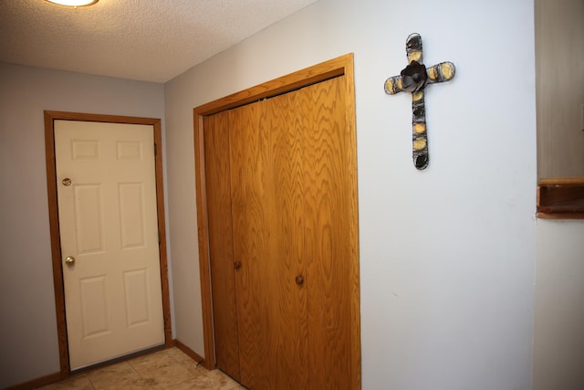 3930 99th Ave NE, Blaine, MN 55014 - corridor featuring a textured ceiling and baseboards