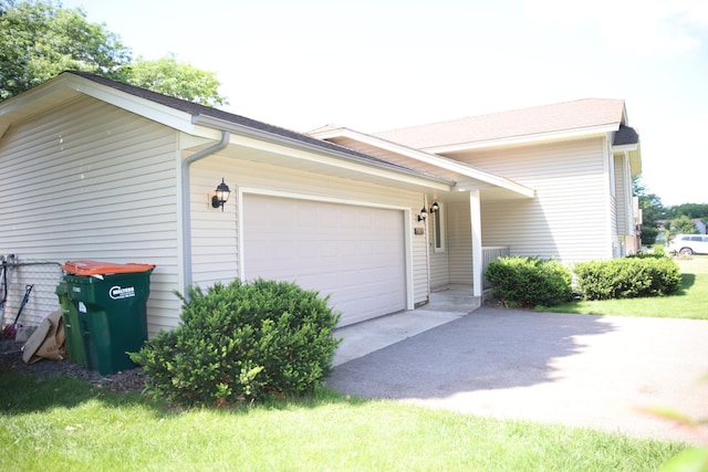 3930 99th Ave NE, Blaine, MN 55014 - view of side of property with an attached garage and asphalt driveway