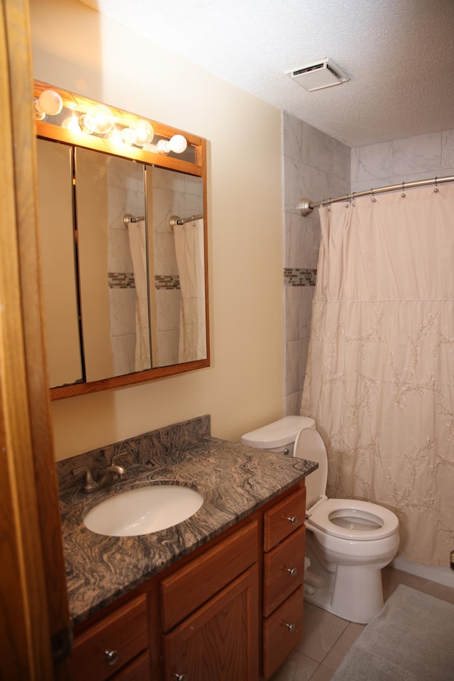 3930 99th Ave NE, Blaine, MN 55014 - full bathroom with vanity, a textured ceiling, tile patterned floors, and a shower with curtain