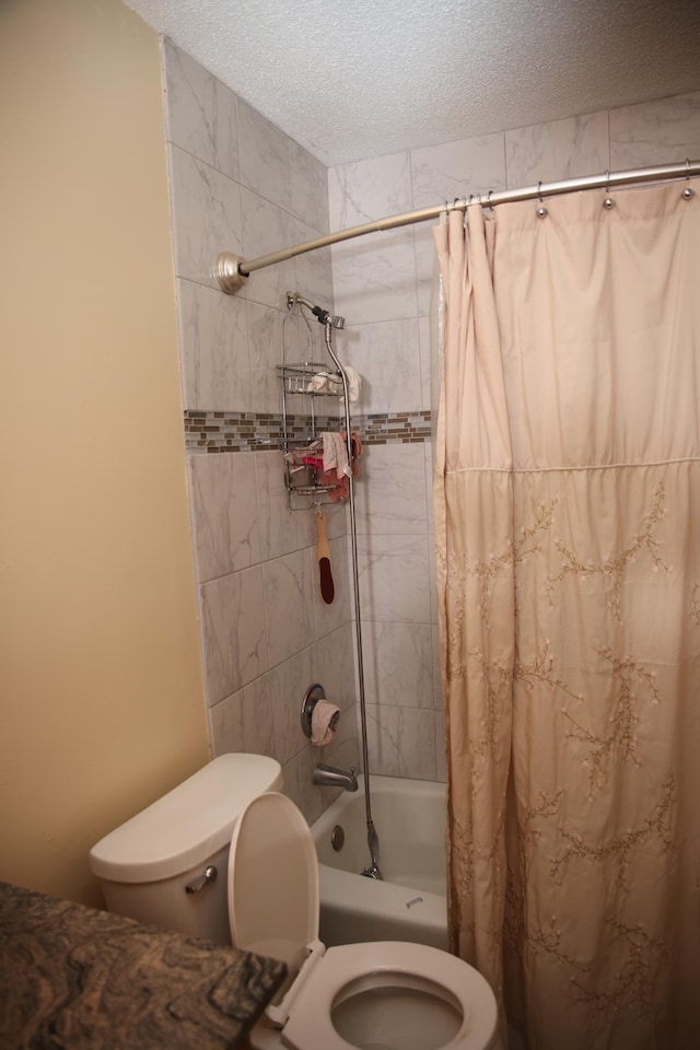 3930 99th Ave NE, Blaine, MN 55014 - bathroom featuring shower / bath combo with shower curtain and a textured ceiling