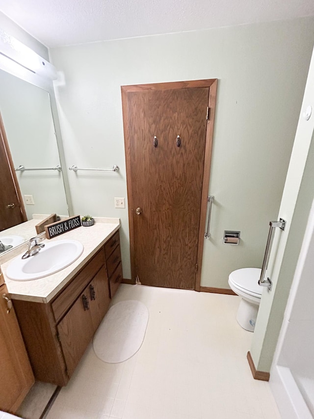 428 16th St, Windom, MN 56101 - bathroom featuring toilet and vanity