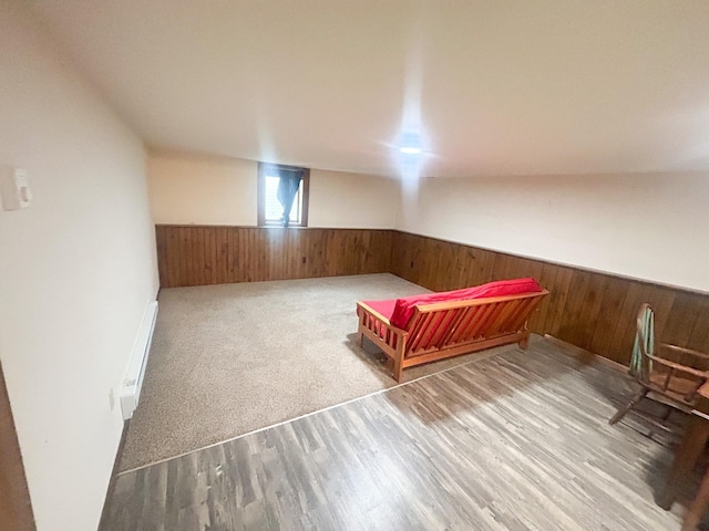 428 16th St, Windom, MN 56101 - unfurnished bedroom with a wainscoted wall, wood walls, and wood finished floors