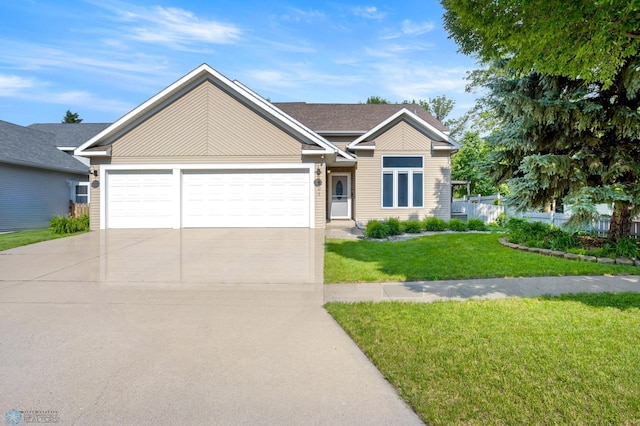 3501 19th St S, Fargo, ND 58104 - view of front of property with concrete driveway, an attached garage, and a front yard