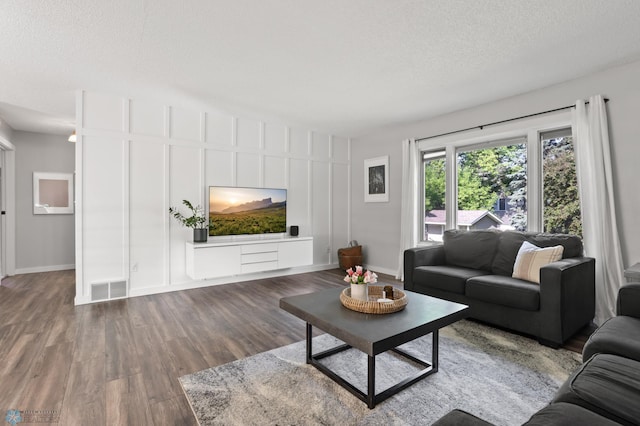 3501 19th St S, Fargo, ND 58104 - living room featuring wood finished floors and a textured ceiling