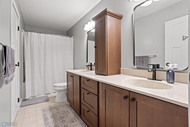 3501 19th St S, Fargo, ND 58104 - full bath featuring double vanity, tile patterned flooring, a textured ceiling, and shower / tub combo