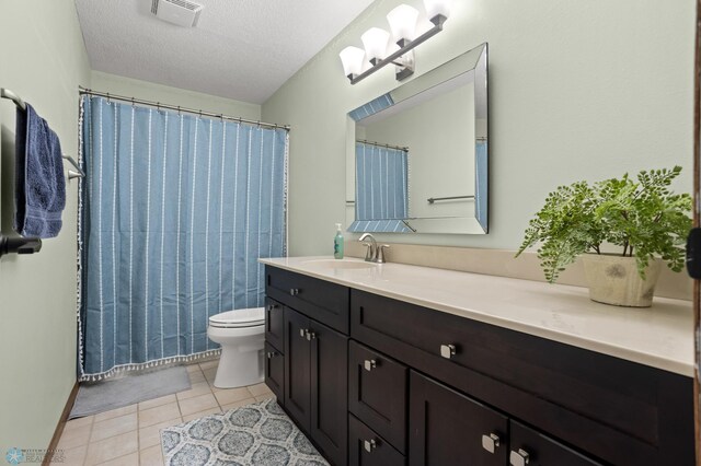 3501 19th St S, Fargo, ND 58104 - full bathroom with vanity, tile patterned flooring, a textured ceiling, and curtained shower