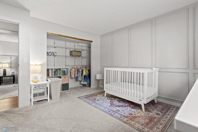 3501 19th St S, Fargo, ND 58104 - carpeted bedroom with a closet and a crib