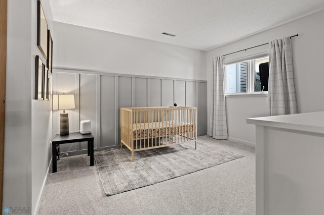 3501 19th St S, Fargo, ND 58104 - bedroom with carpet, a decorative wall, and a wainscoted wall