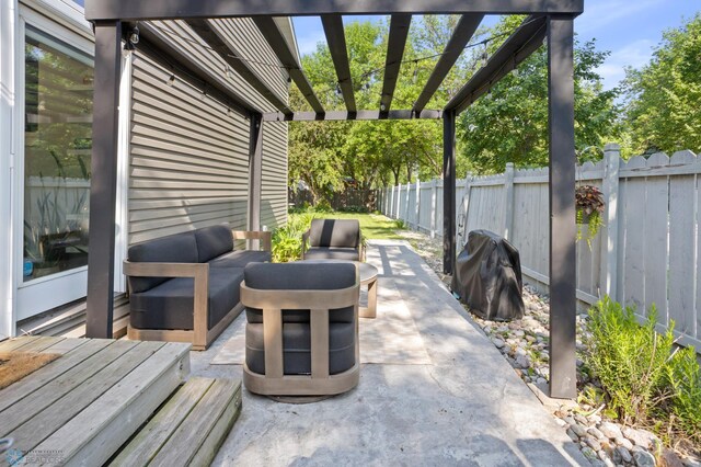 3501 19th St S, Fargo, ND 58104 - fenced backyard with grilling area, an outdoor living space, a patio, and a pergola