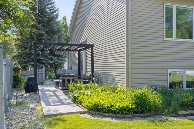 3501 19th St S, Fargo, ND 58104 - view of property exterior with a patio area and a pergola