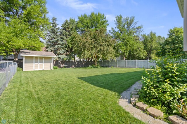 3501 19th St S, Fargo, ND 58104 - fenced backyard featuring an outbuilding