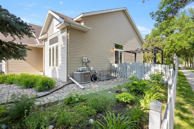 3501 19th St S, Fargo, ND 58104 - view of side of property featuring a cooling unit and a pergola