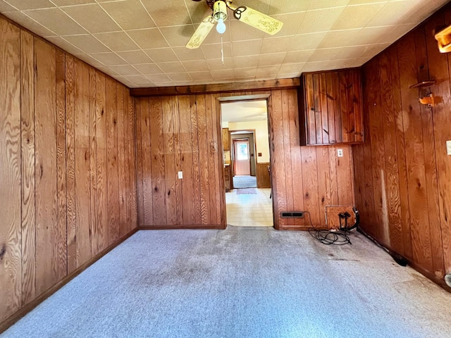 290 5th Ave, Granite Falls, MN 56241 - carpeted spare room with wood walls and ceiling fan