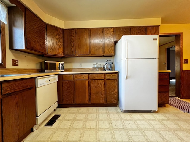 290 5th Ave, Granite Falls, MN 56241 - kitchen with white appliances, light countertops, and light floors