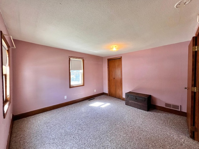 290 5th Ave, Granite Falls, MN 56241 - carpeted spare room with a textured ceiling and baseboards
