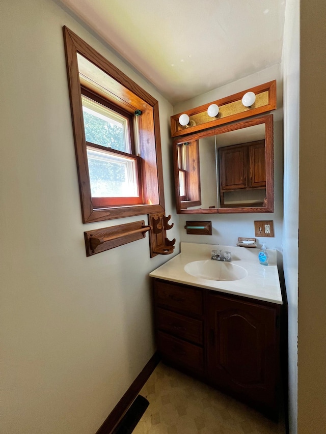 290 5th Ave, Granite Falls, MN 56241 - bathroom with vanity and baseboards