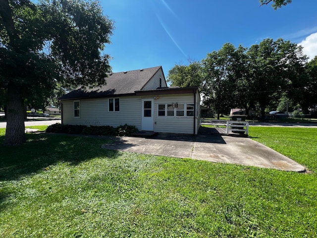 290 5th Ave, Granite Falls, MN 56241 - rear view of property with a yard and a patio area