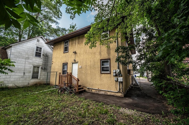 1194 Forest St, Saint Paul, MN 55106 - rear view of house with stucco siding