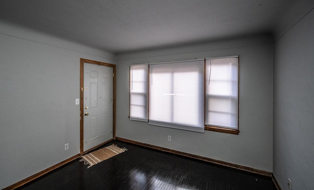 1194 Forest St, Saint Paul, MN 55106 - empty room featuring baseboards and wood finished floors