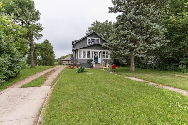 27960 County Highway 88, Carlisle Twp, MN 56537 - bungalow-style house with a front yard, a detached garage, and driveway