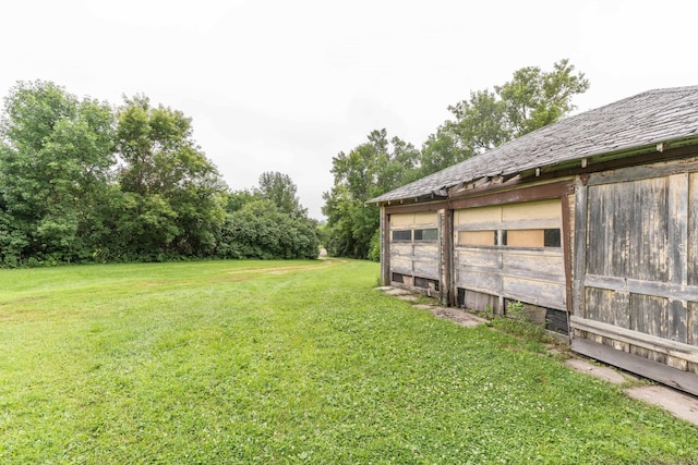 27960 County Highway 88, Carlisle Twp, MN 56537 - view of grassy yard featuring an outbuilding and a garage