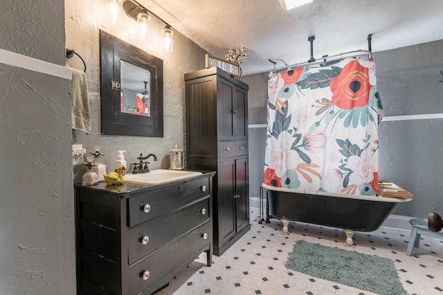 27960 County Highway 88, Carlisle Twp, MN 56537 - bathroom featuring a textured wall, tile patterned floors, a freestanding tub, vanity, and a shower with curtain