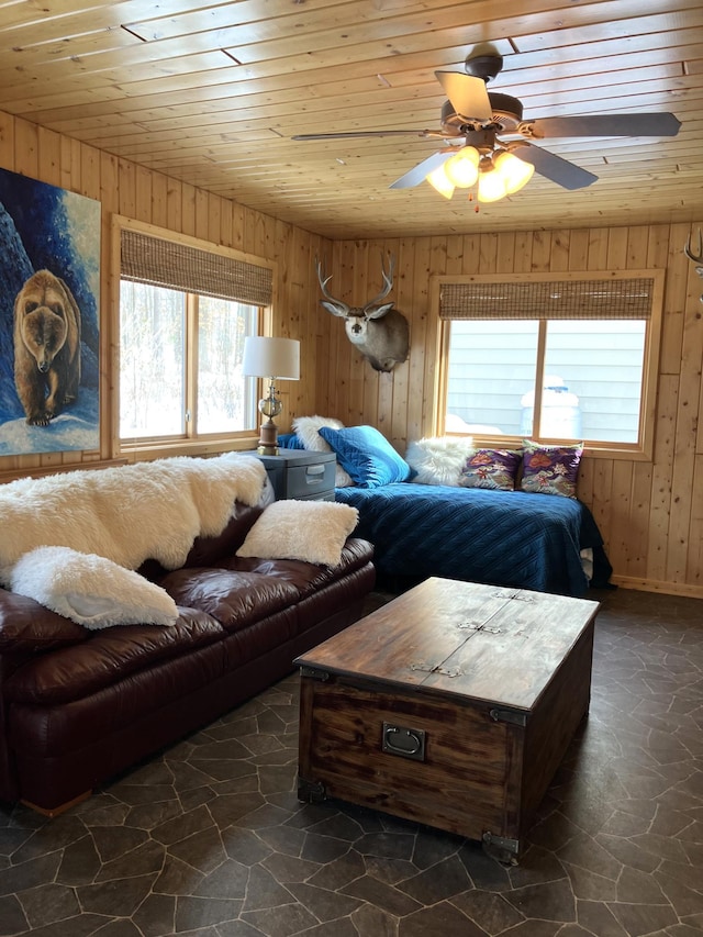 2040 Summit Dr, Cushing, MN 56443 - bedroom featuring wood walls, wooden ceiling, stone finish flooring, and a ceiling fan