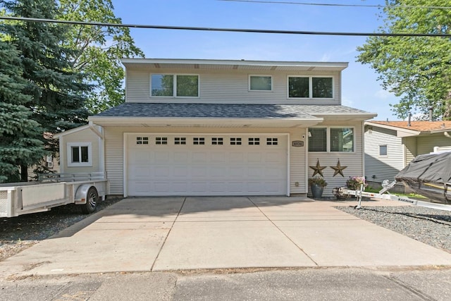 4936 210th St N, Forest Lake, MN 55025 - traditional home with a garage, driveway, and roof with shingles