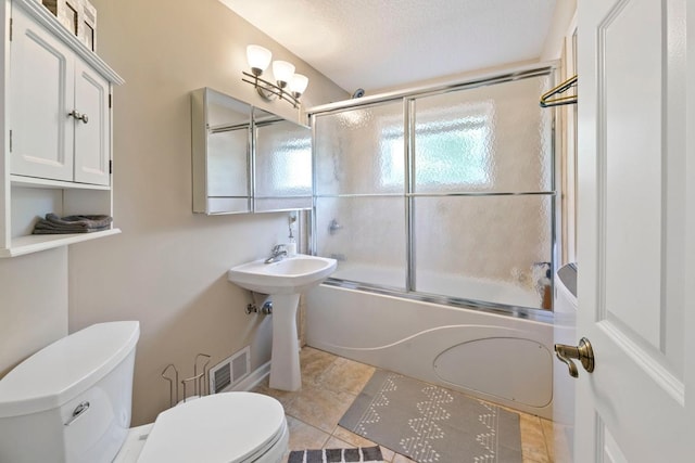 4936 210th St N, Forest Lake, MN 55025 - bathroom with enclosed tub / shower combo and tile patterned flooring