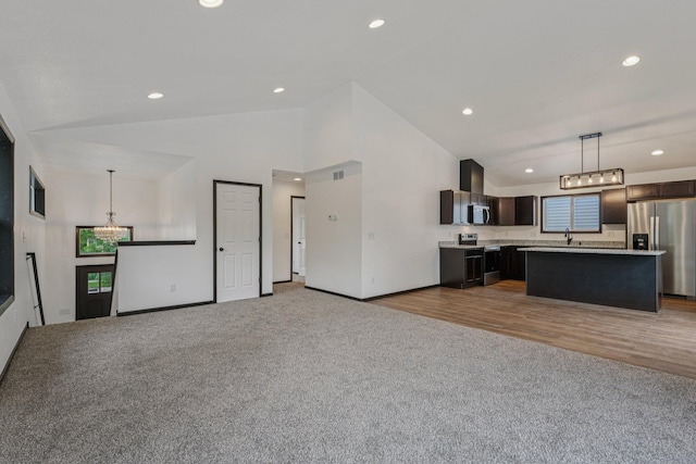 1002 Conway St, Saint Paul, MN 55106 - kitchen featuring stainless steel appliances, light carpet, light countertops, dark brown cabinets, and recessed lighting