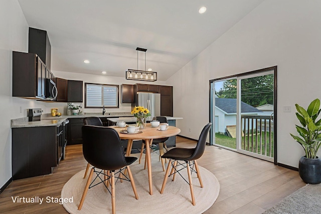 1002 Conway St, Saint Paul, MN 55106 - dining room featuring light wood finished floors, healthy amount of natural light, high vaulted ceiling, and recessed lighting