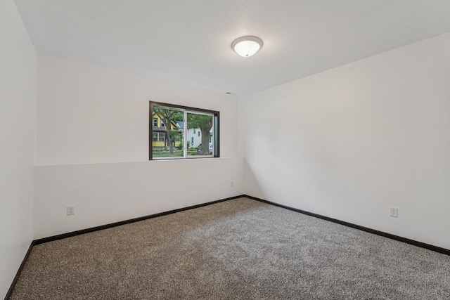 1002 Conway St, Saint Paul, MN 55106 - carpeted spare room with baseboards