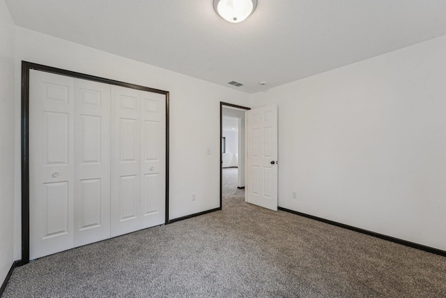 1002 Conway St, Saint Paul, MN 55106 - unfurnished bedroom with carpet floors and a closet