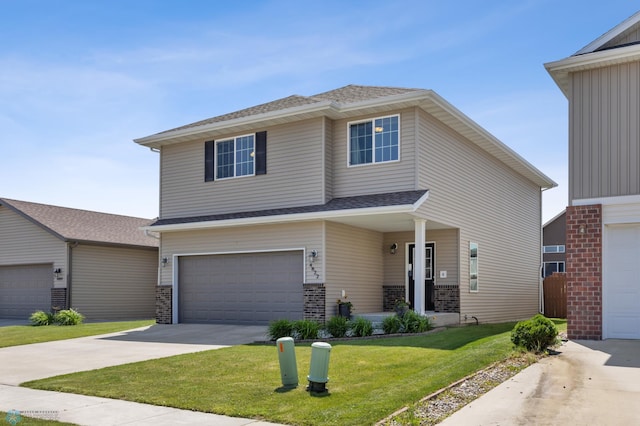 4822 34th Ave S, Fargo, ND 58104 - view of front facade with a front lawn, an attached garage, concrete driveway, and roof with shingles