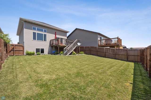 4822 34th Ave S, Fargo, ND 58104 - rear view of house featuring a wooden deck, a fenced backyard, and stairway