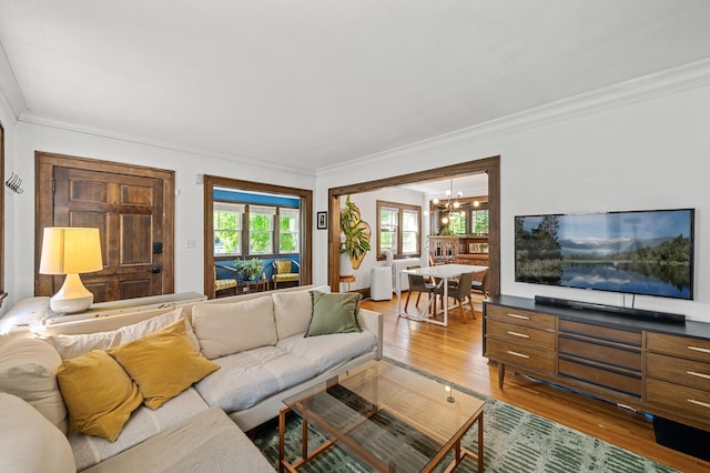 3841 Columbus Ave, Minneapolis, MN 55407 - living room with a chandelier, wood finished floors, and crown molding